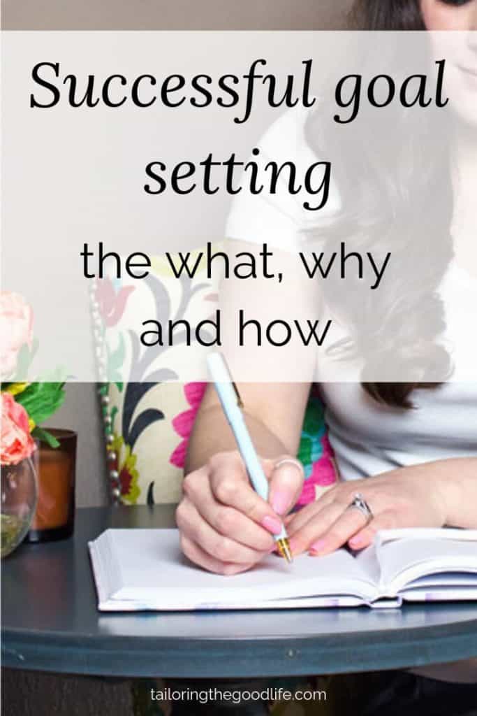 woman in floral chair writing in notebook, she's setting goals