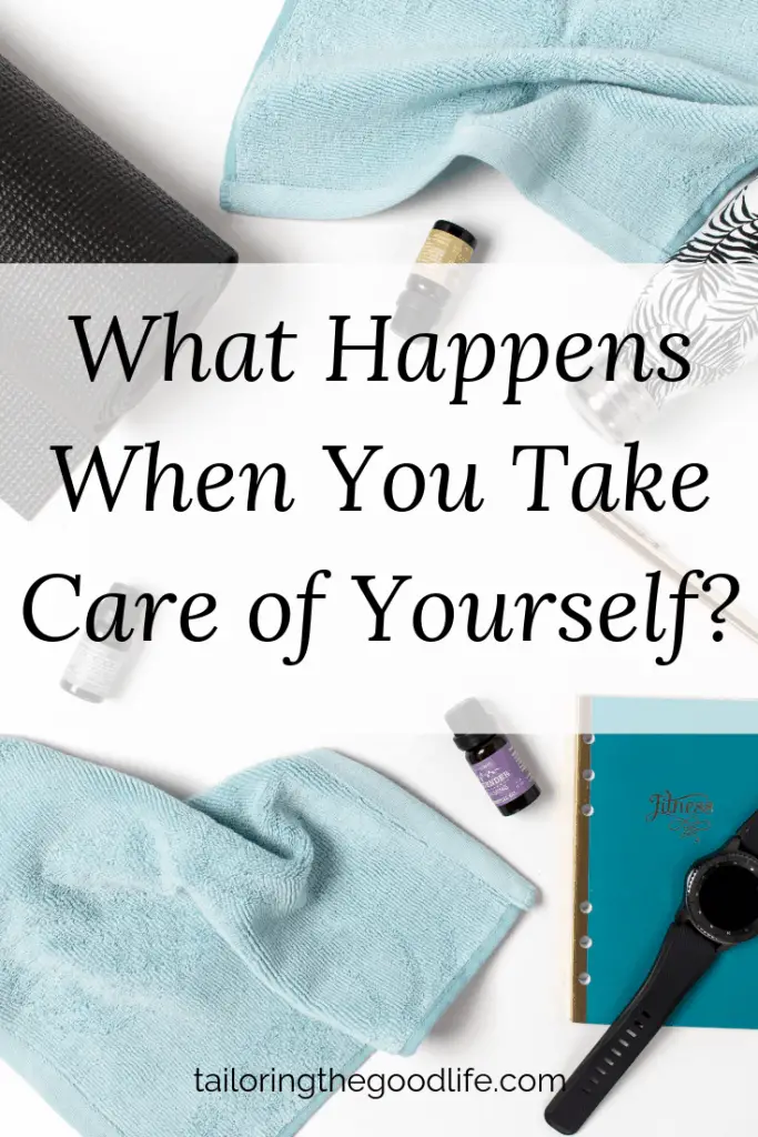 flat lay of table with essential oils, a yogamat, a towel, and a water bottle - take care of yourself